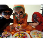 Kids eating Halloween candy.