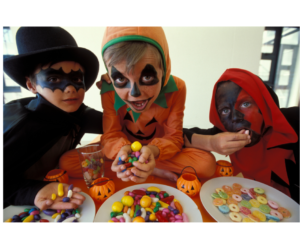 Kids eating Halloween candy.