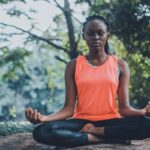 Woman meditating and breathing for guided relaxation