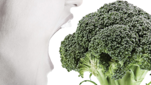 Person eating broccoli to represent disordered eating