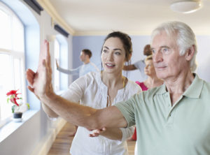Student and teacher in a tai chi class.