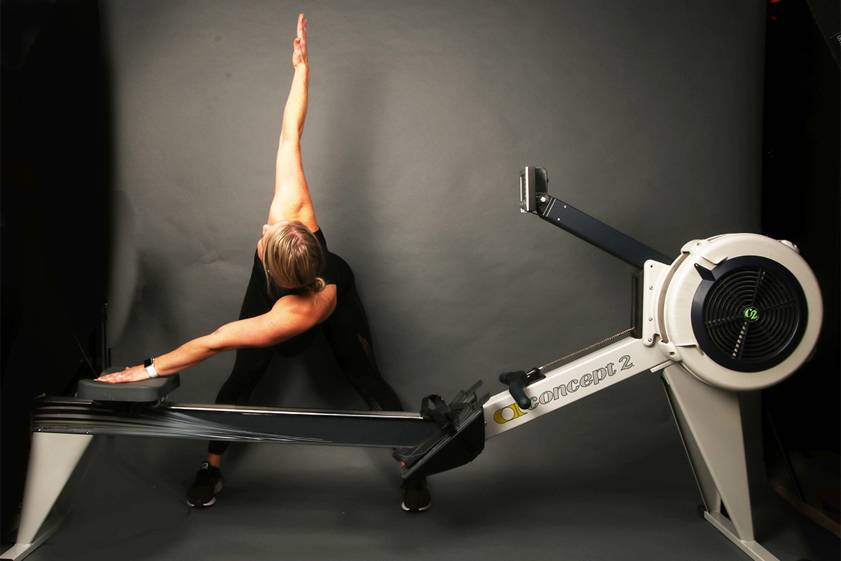 Wide Leg Forward Fold with Ergometer Supported Twist for rowing recovery