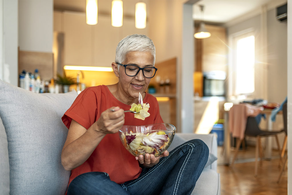 A lady eating plant-based
