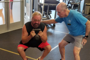 Personal trainer Tim Minnick and client Rocky E