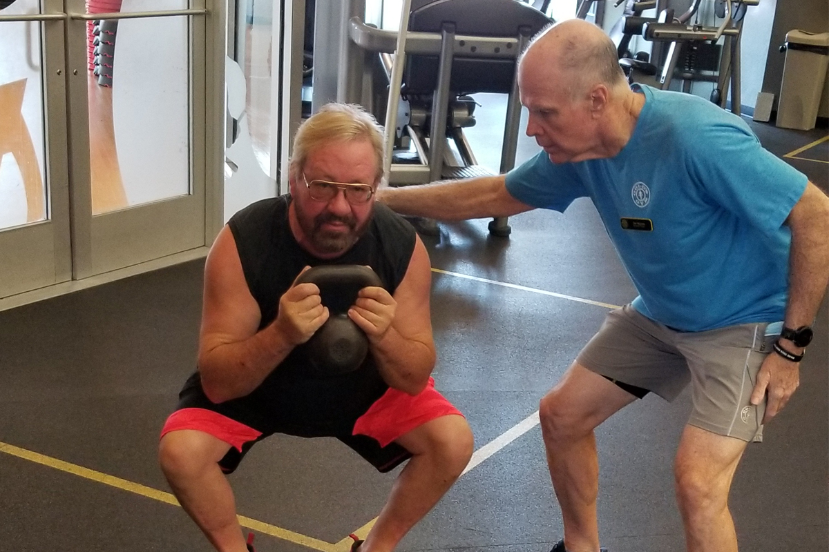 Personal trainer Tim Minnick and client Rocky E