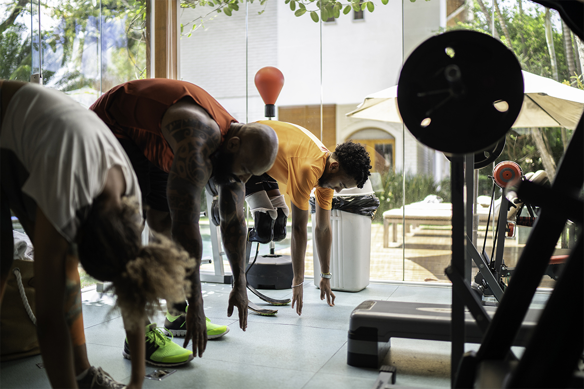 Black men exercising at a gym