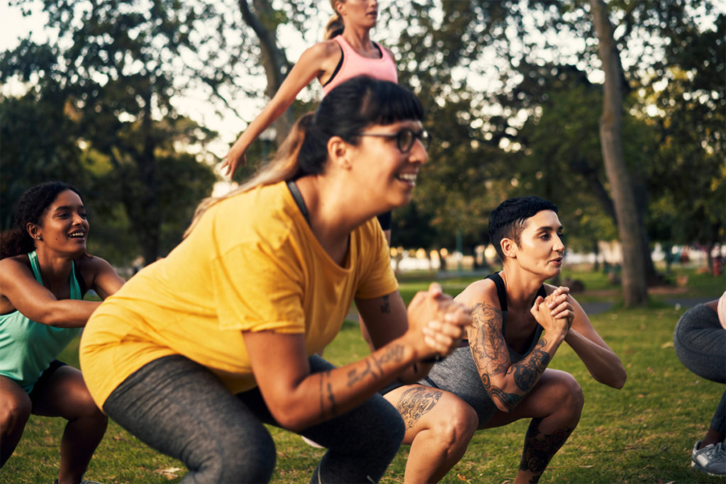 Women exercising during a park workout