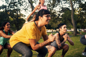 Women exercising during a park workout