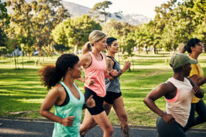 Women running during a park workout
