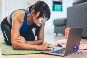 A woman taking FiTOUR education courses on a laptop