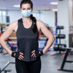 Woman wearing face mask post-pandemic at gym
