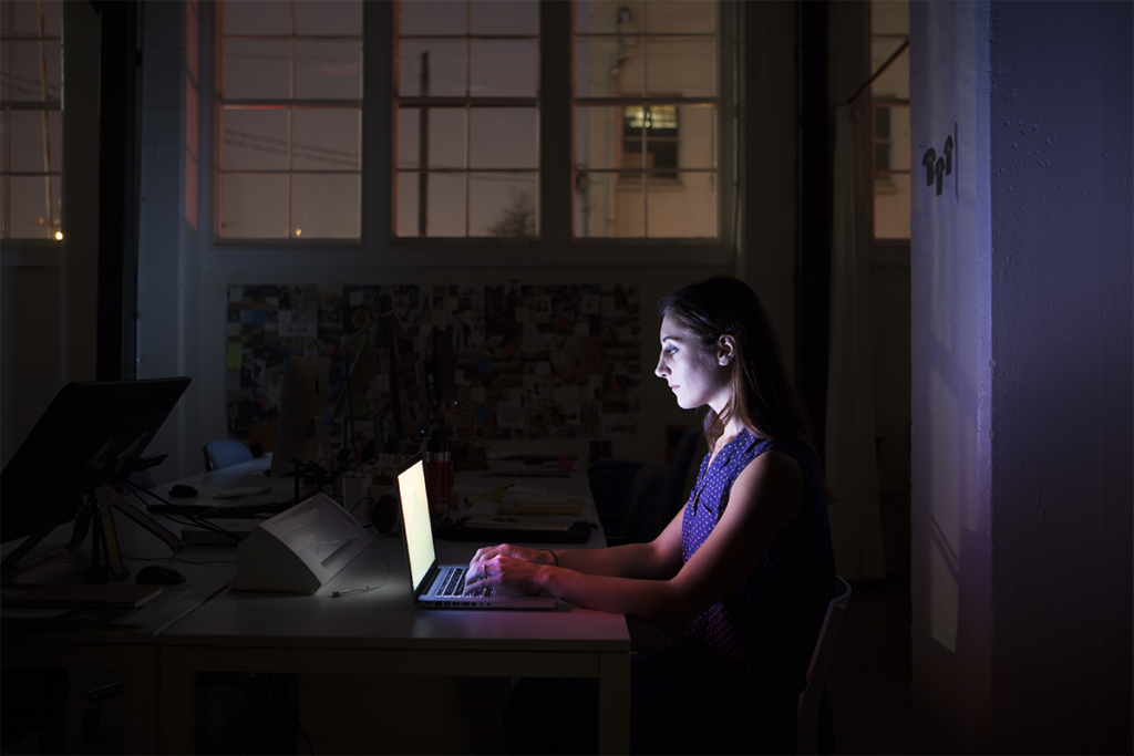 Woman staying up late in front of her computer