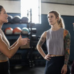 Women conversing at a gym