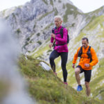 Older athletes hiking outside