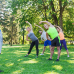 A group of people doing outdoor fitness at a park