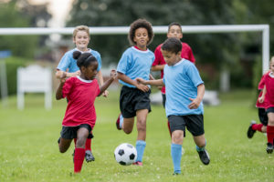 Young athletes playing soccer