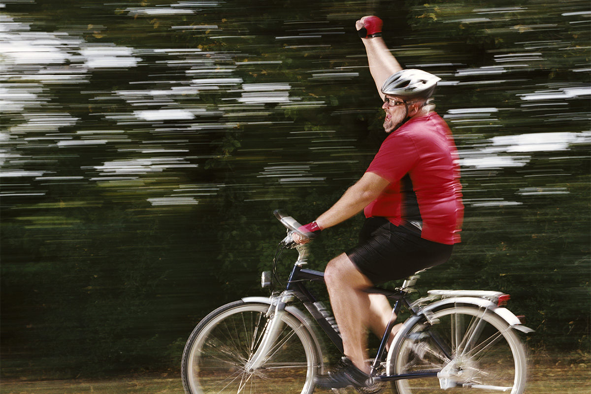 Man on a bike for exercise and liver health