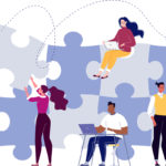 People putting puzzle pieces together to show business collaboration