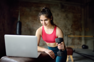 Woman practicing virtual training in fitness hybridization