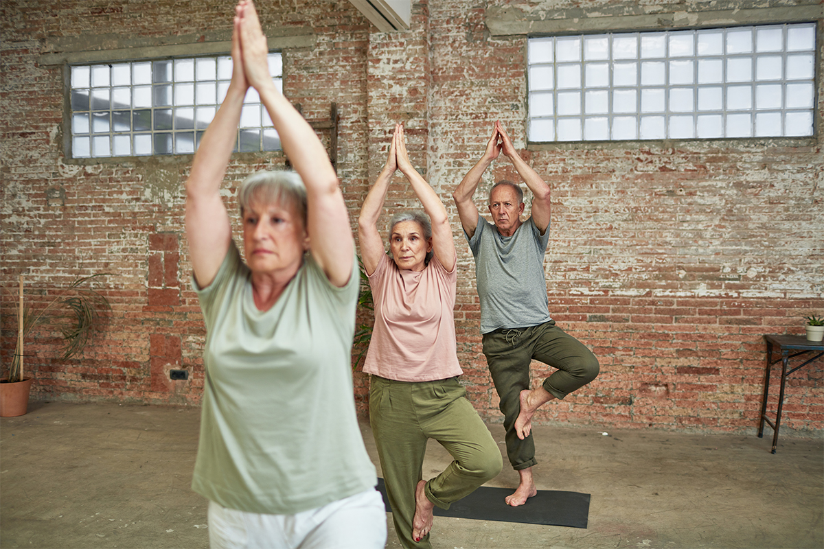 People practicing yoga for seniors