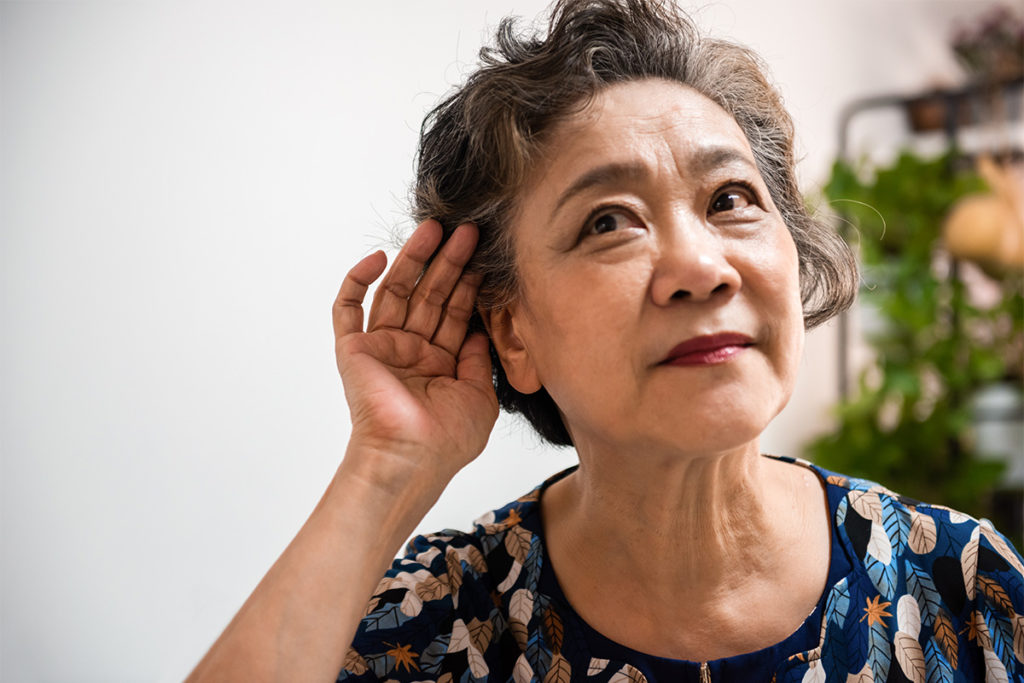 Elderly woman hard to hear Older woman with hearing loss