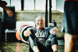 Older man exercising for health and lower healthcare costs