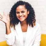 Woman waving with wrist joint