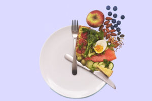 Food plate arrange like a clock to illustrate intermittent fasting