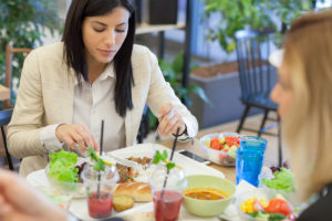 Woman eating cafeteria food