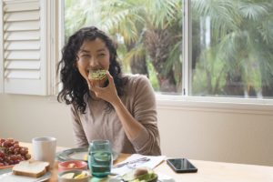 Woman eating breakfast