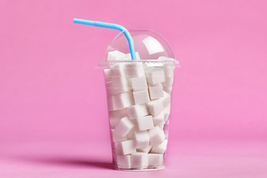 Cup full of added sugar cubes