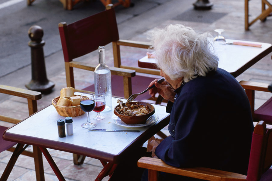 Older woman dining alone