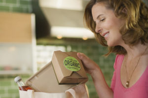 Woman looking at food packaging