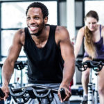 People taking indoor cycling class