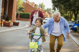 Older man with child using movement as everyday athletes