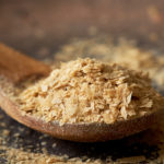 Spoonful of nutritional yeast, known as nooch