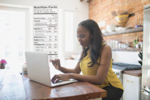 Woman reading online nutrition labels