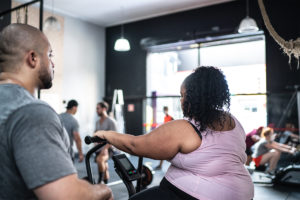 Trainer helping client with exercise for diabetes