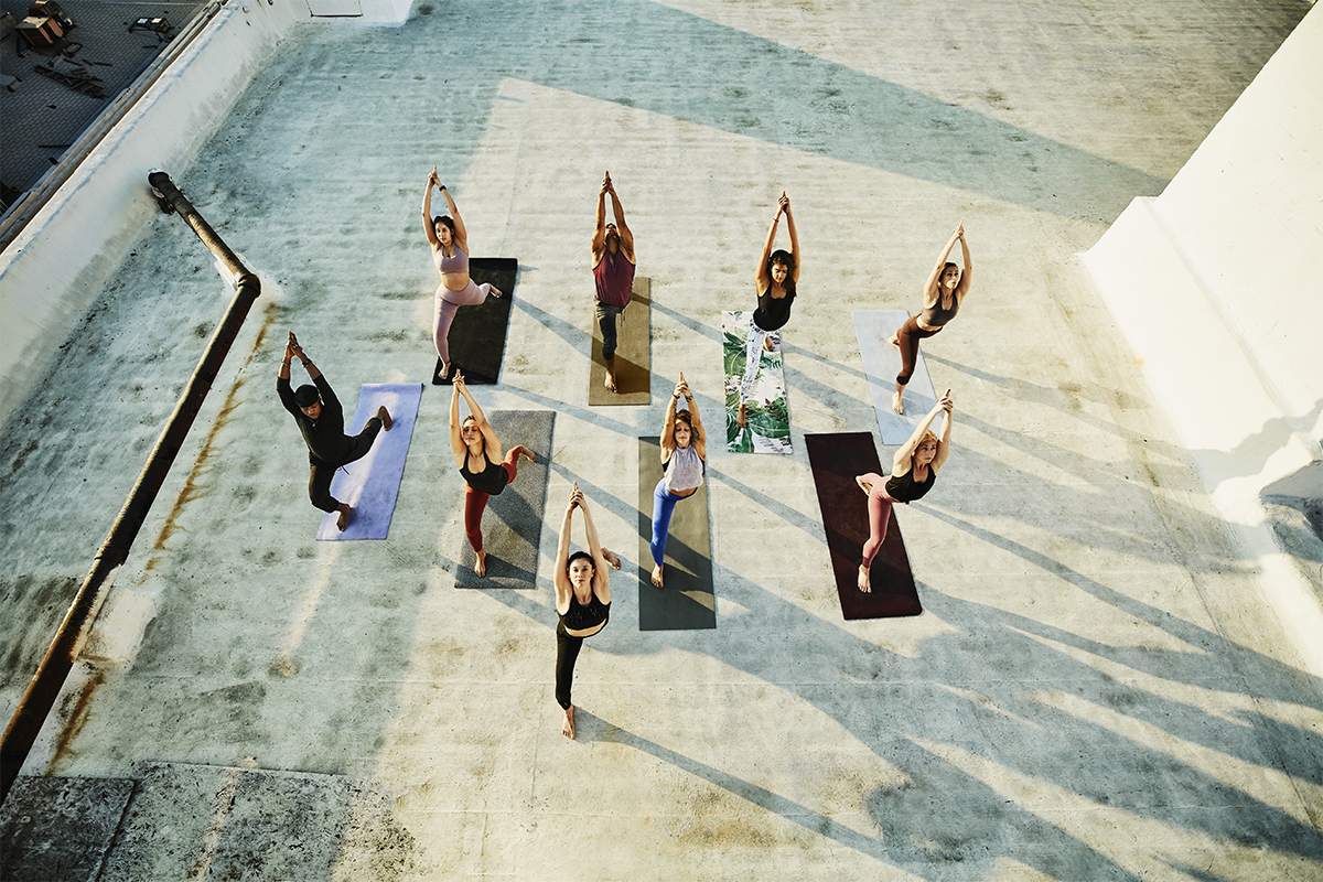 Group of people performing yoga