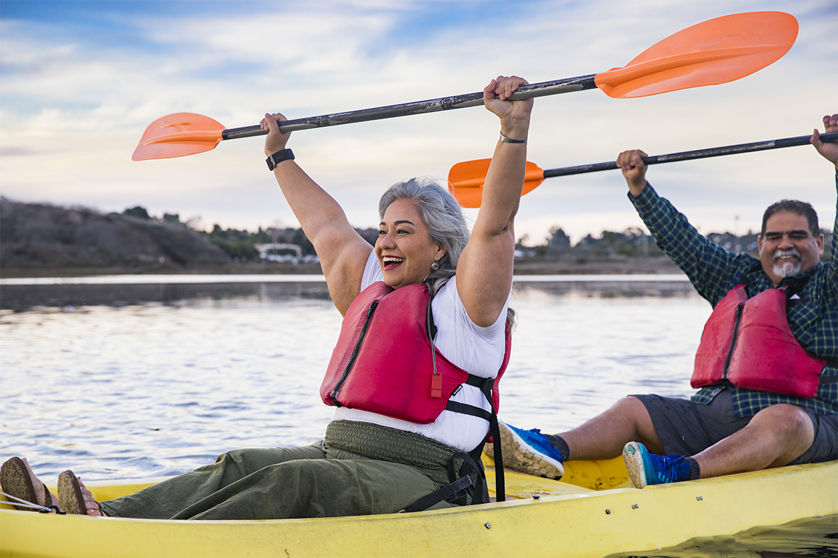 Two people on a kayak showing self-motivation