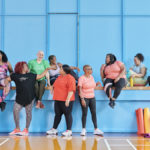 People building community in fitness class