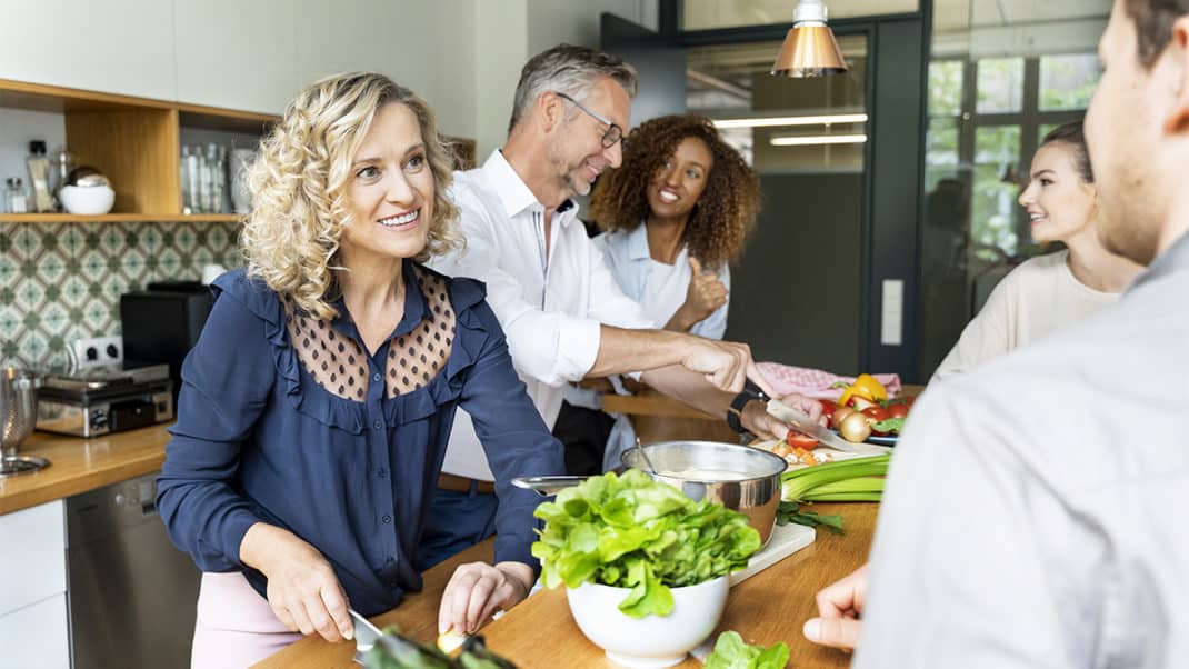 People cooking in kitchen to show lifestyle exercise barriers