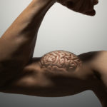 Photoshopped image with brain on bicep to show link between exercise and brain health