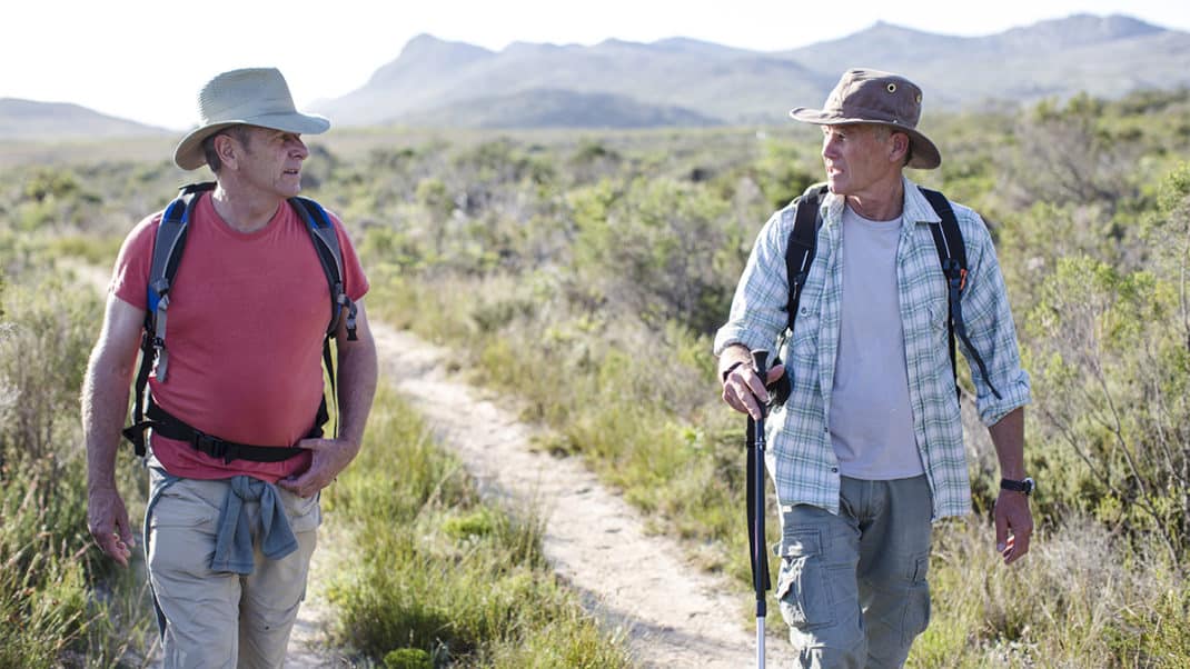 Two men walking for knee pain