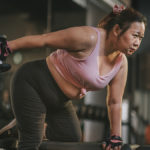 Woman completing split workout routine