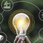 Lightbulb and icons representing sustainability practices