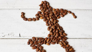 Coffee beans in the shape of a runner to represent caffeine and athletes