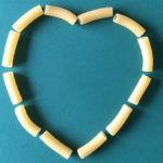 Heart made from macaroni to show carbs and dieting