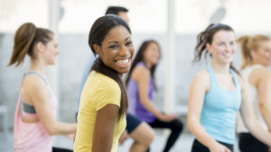 Young woman smiling to show mental health and wellness