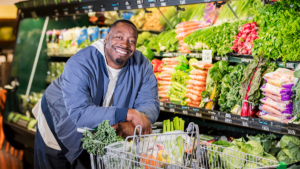 Man shopping in produce section for healthy diet